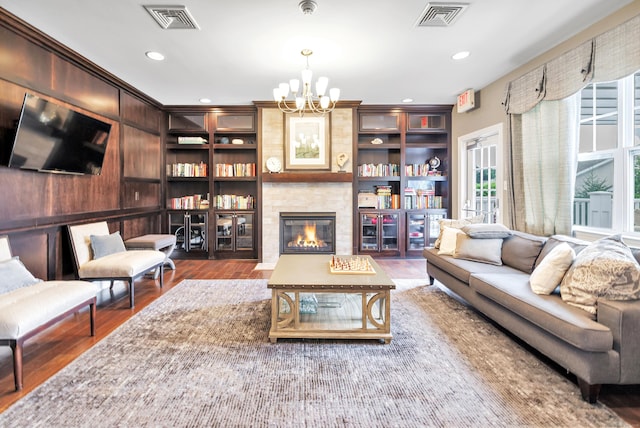 605 Brookside Ct Unit 605, Newtown, CT 06470 - living area with a chandelier, wood finished floors, a fireplace, and recessed lighting