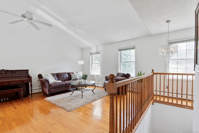 120 Plank Hill Rd, Simsbury, CT 06070 - living room featuring a baseboard radiator, wood finished floors, vaulted ceiling, a chandelier, and ceiling fan