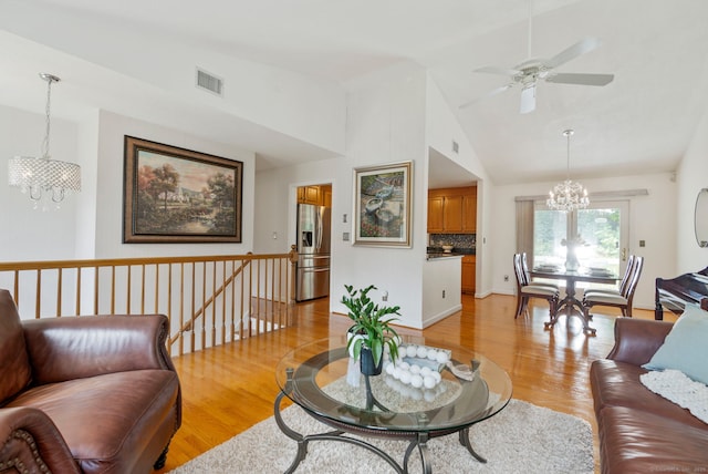 120 Plank Hill Rd, Simsbury, CT 06070 - living room with a chandelier, light wood-style flooring, vaulted ceiling, and a ceiling fan