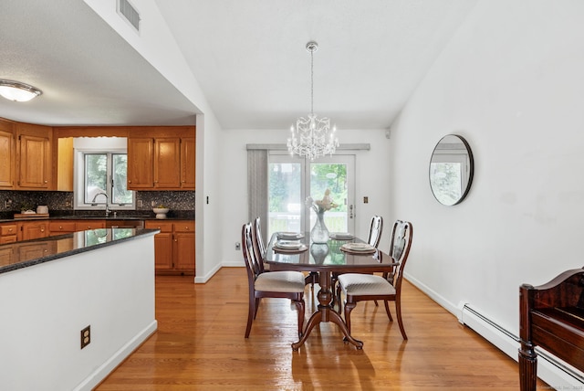 120 Plank Hill Rd, Simsbury, CT 06070 - dining space featuring healthy amount of natural light, a chandelier, light wood-style flooring, and vaulted ceiling