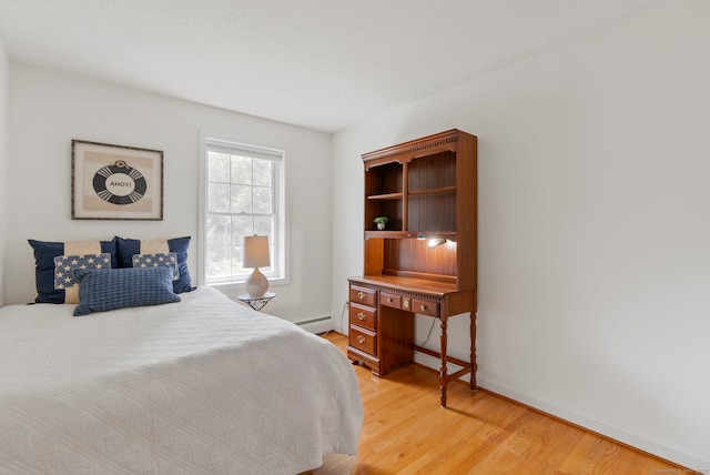120 Plank Hill Rd, Simsbury, CT 06070 - bedroom featuring light wood-type flooring and a baseboard heating unit