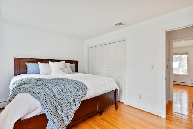 120 Plank Hill Rd, Simsbury, CT 06070 - bedroom with light wood-type flooring, a closet, and baseboard heating