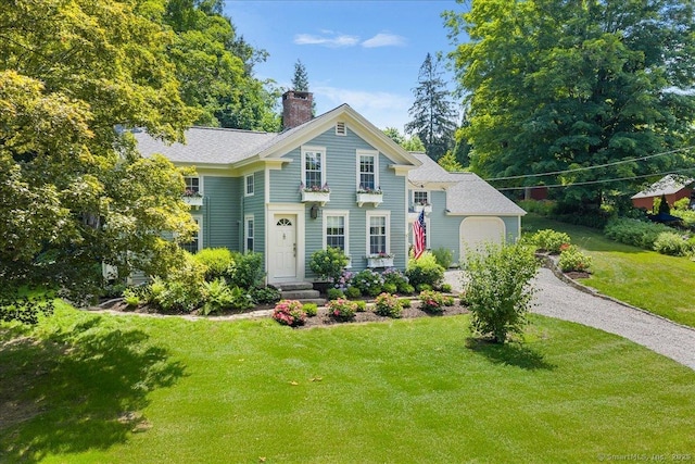 25 Spring St, Chester, CT 06412 - view of front of house featuring a chimney, a front yard, and gravel driveway