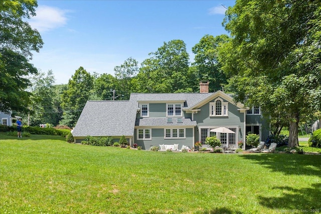 25 Spring St, Chester, CT 06412 - shingle-style home featuring a chimney, a front yard, and roof with shingles