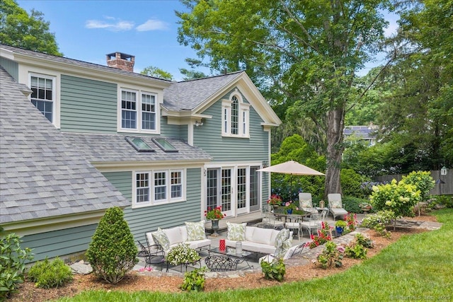25 Spring St, Chester, CT 06412 - back of house featuring outdoor lounge area, a patio area, a chimney, and roof with shingles