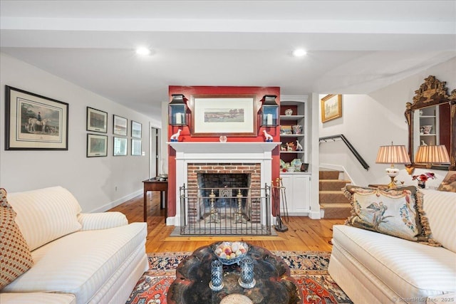 25 Spring St, Chester, CT 06412 - living area with stairs, wood finished floors, a brick fireplace, and recessed lighting