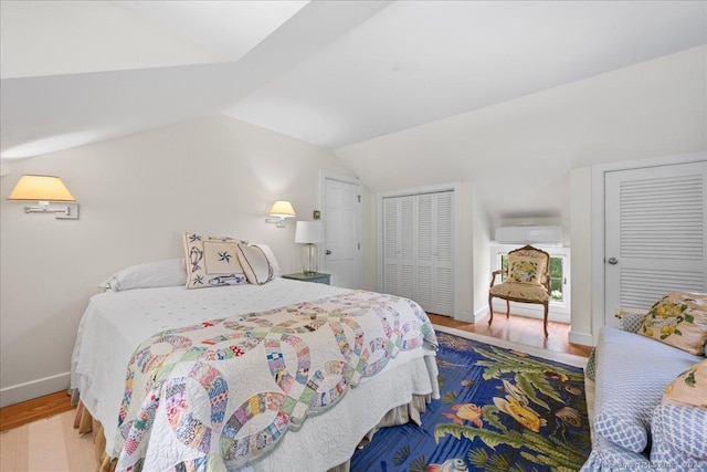 25 Spring St, Chester, CT 06412 - bedroom with vaulted ceiling, an AC wall unit, and wood finished floors