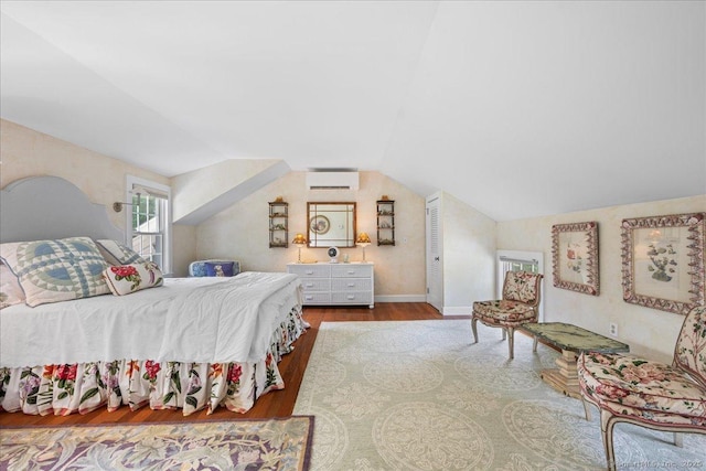 25 Spring St, Chester, CT 06412 - bedroom featuring a wall mounted AC, vaulted ceiling, and wood finished floors
