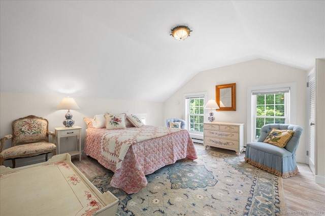 25 Spring St, Chester, CT 06412 - bedroom with vaulted ceiling, light wood-type flooring, baseboard heating, and a baseboard heating unit