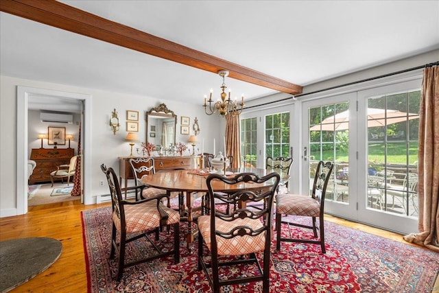 25 Spring St, Chester, CT 06412 - dining space featuring a wall mounted AC, a chandelier, beamed ceiling, wood finished floors, and a baseboard radiator
