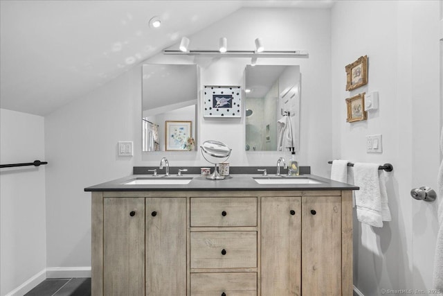 25 Spring St, Chester, CT 06412 - bathroom featuring lofted ceiling and double vanity