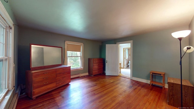 183 Schroback Rd, Plymouth, CT 06782 - unfurnished bedroom with a baseboard radiator and wood finished floors