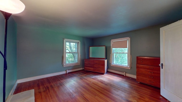 183 Schroback Rd, Plymouth, CT 06782 - empty room with baseboard heating, a baseboard radiator, and wood finished floors