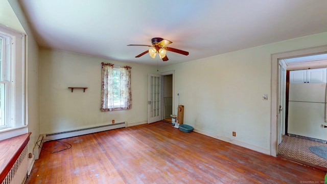 183 Schroback Rd, Plymouth, CT 06782 - spare room with wood finished floors, a baseboard heating unit, and ceiling fan