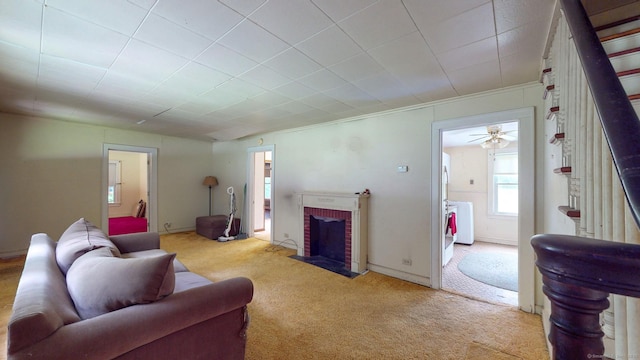 183 Schroback Rd, Plymouth, CT 06782 - carpeted living area featuring a fireplace and independent washer and dryer