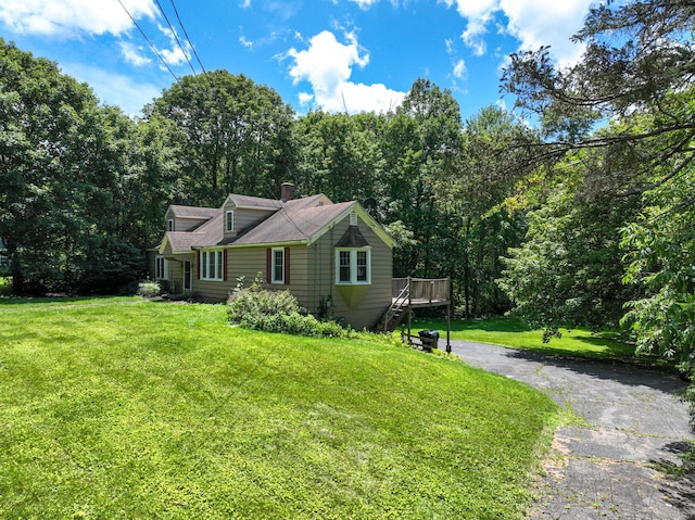183 Schroback Rd, Plymouth, CT 06782 - view of front of home featuring a front yard, a deck, and a chimney