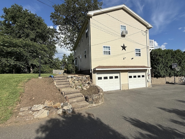 7 School St, Burlington, CT 06013 - view of home's exterior with a garage, driveway, and cooling unit