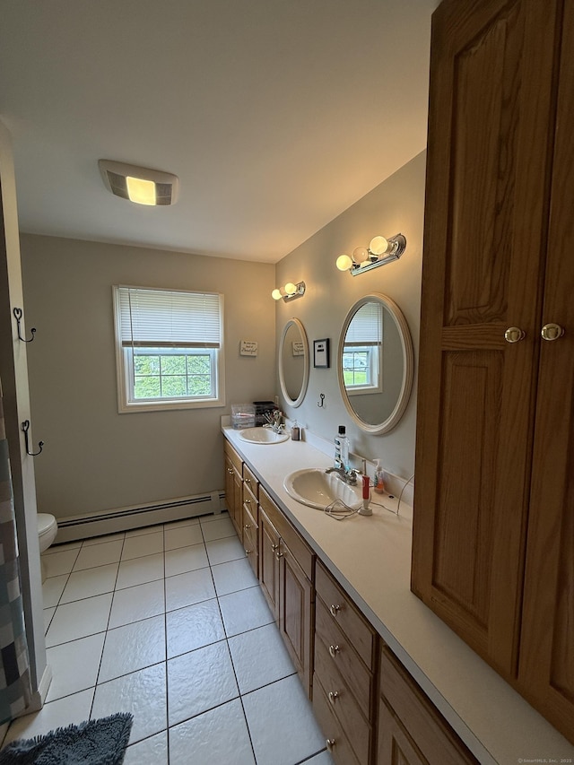 7 School St, Burlington, CT 06013 - bathroom with a baseboard heating unit, double vanity, and tile patterned floors