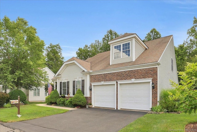 33 Wadsworth Ln Unit 33, Wallingford, CT 06492 - view of front of property with brick siding, asphalt driveway, a front lawn, and a garage