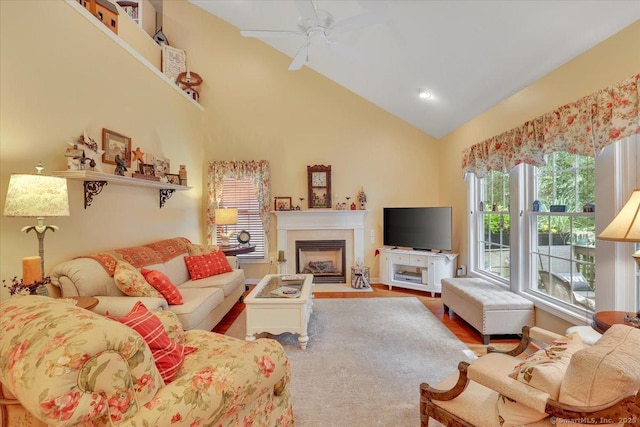 33 Wadsworth Ln Unit 33, Wallingford, CT 06492 - living room featuring a ceiling fan, a fireplace with flush hearth, vaulted ceiling, and wood finished floors