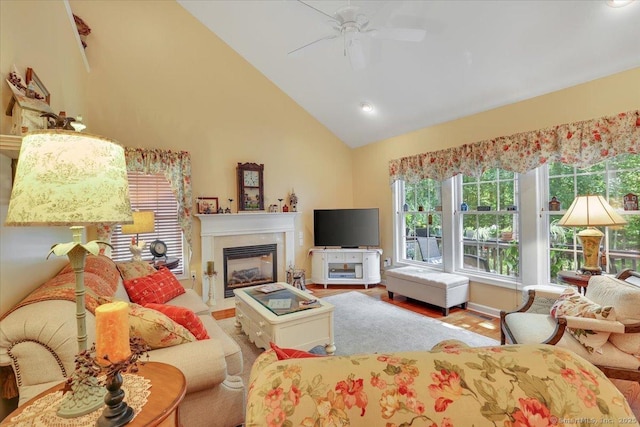 33 Wadsworth Ln Unit 33, Wallingford, CT 06492 - living room with a ceiling fan, a glass covered fireplace, high vaulted ceiling, wood finished floors, and recessed lighting