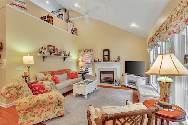 33 Wadsworth Ln Unit 33, Wallingford, CT 06492 - living room with a ceiling fan, a fireplace with flush hearth, wood finished floors, high vaulted ceiling, and recessed lighting