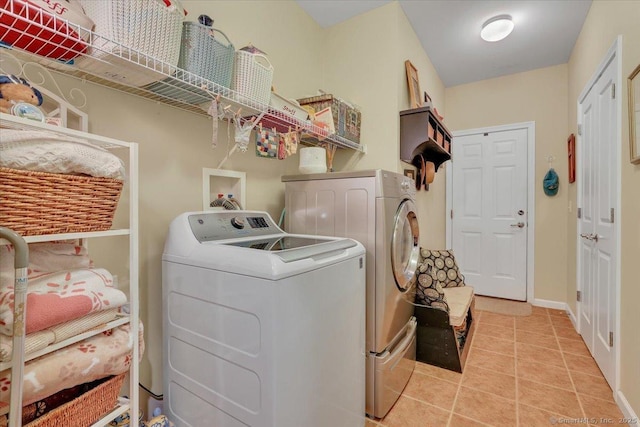 33 Wadsworth Ln Unit 33, Wallingford, CT 06492 - laundry room featuring washer and clothes dryer and light tile patterned floors