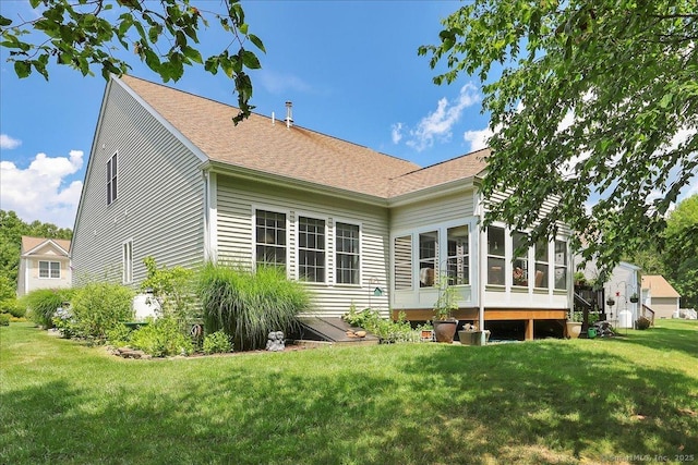 33 Wadsworth Ln Unit 33, Wallingford, CT 06492 - back of house featuring a lawn, a sunroom, and a shingled roof