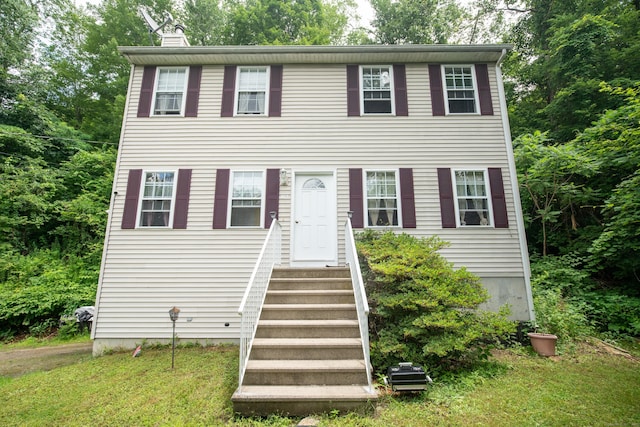82 Pleasant St, Thomaston, CT 06787 - colonial-style house with entry steps, a chimney, and a front lawn