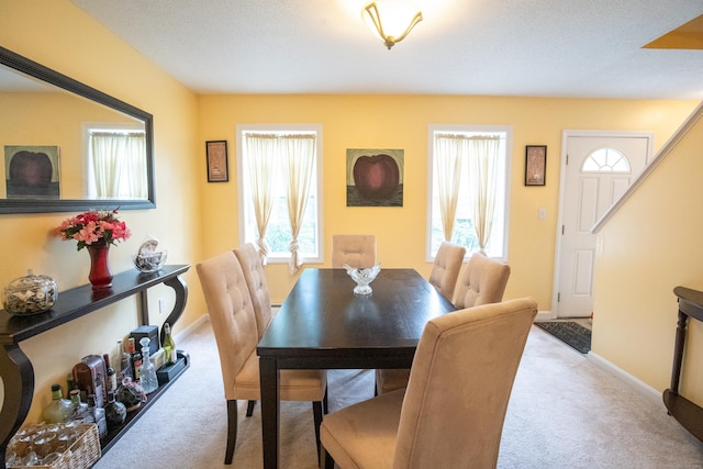 82 Pleasant St, Thomaston, CT 06787 - carpeted dining space featuring baseboards and stairs
