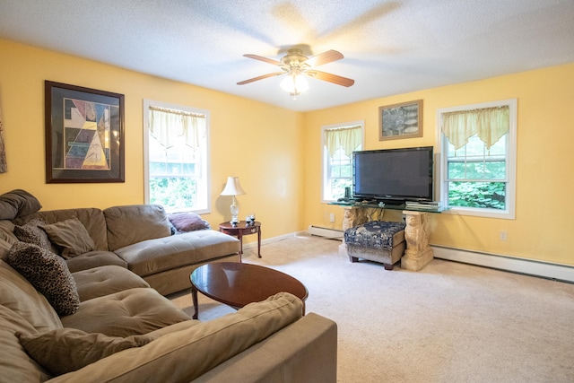 82 Pleasant St, Thomaston, CT 06787 - carpeted living room with a baseboard heating unit and ceiling fan