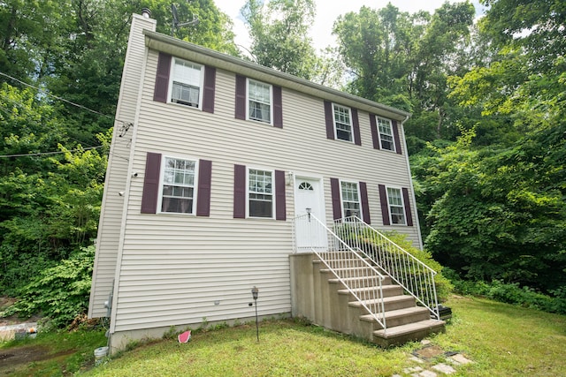 82 Pleasant St, Thomaston, CT 06787 - colonial-style house with a chimney and a front lawn