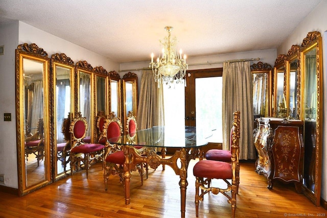400 Williams Rd, Wallingford, CT 06492 - dining area featuring a chandelier, wood finished floors, french doors, and a textured ceiling