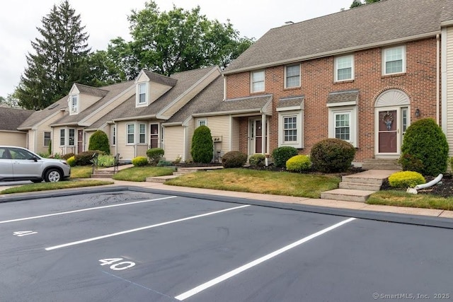 40 Orchard Brook Dr Unit 40, Wethersfield, CT 06109 - multi unit property with uncovered parking, brick siding, and roof with shingles