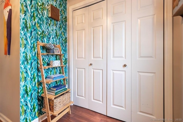 40 Orchard Brook Dr Unit 40, Wethersfield, CT 06109 - bedroom featuring a closet, dark wood-style flooring, and wallpapered walls