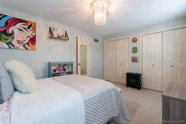 40 Orchard Brook Dr Unit 40, Wethersfield, CT 06109 - carpeted bedroom featuring two closets and a chandelier
