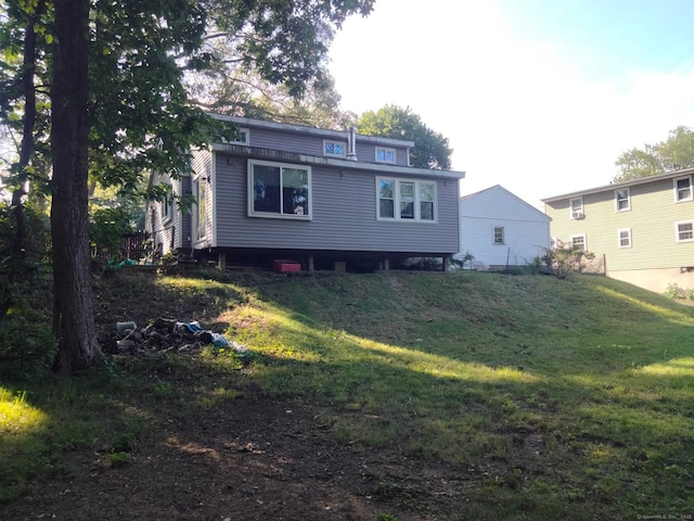 142 S Center St, Windsor Locks, CT 06096 - back of house featuring a lawn