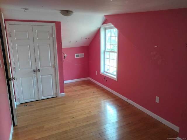 142 S Center St, Windsor Locks, CT 06096 - additional living space featuring light wood-style floors and vaulted ceiling
