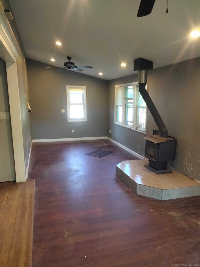 142 S Center St, Windsor Locks, CT 06096 - unfurnished living room featuring ceiling fan, a wood stove, wood finished floors, recessed lighting, and vaulted ceiling