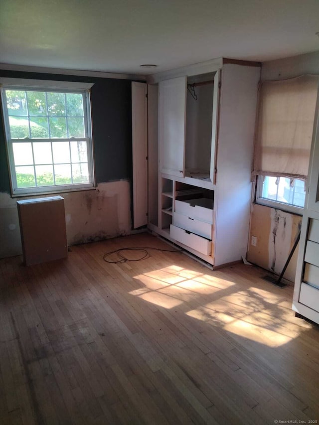 142 S Center St, Windsor Locks, CT 06096 - unfurnished bedroom with light wood-type flooring