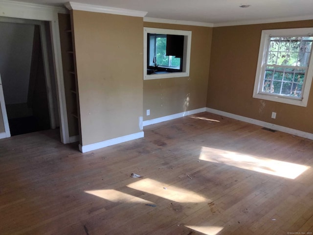 142 S Center St, Windsor Locks, CT 06096 - spare room featuring wood finished floors and crown molding
