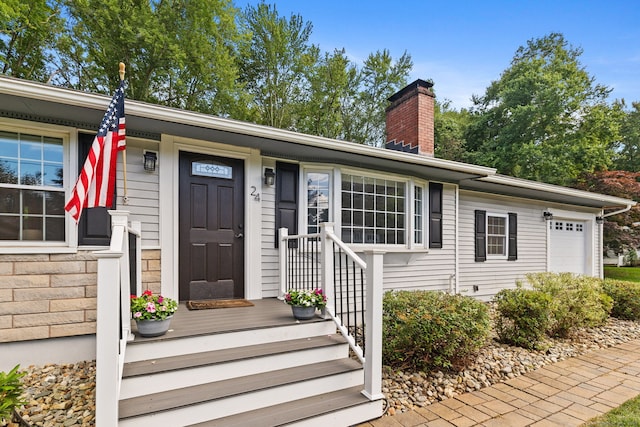 24 Wapping Wood Rd, Ellington, CT 06029 - view of front of home featuring a garage and a chimney