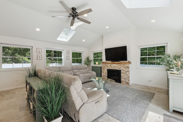 24 Wapping Wood Rd, Ellington, CT 06029 - living area featuring a skylight, a fireplace with flush hearth, ceiling fan, recessed lighting, and high vaulted ceiling