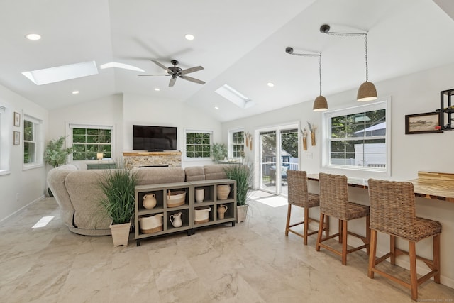 24 Wapping Wood Rd, Ellington, CT 06029 - living area featuring a skylight, lofted ceiling, light marble finish flooring, a ceiling fan, and healthy amount of natural light