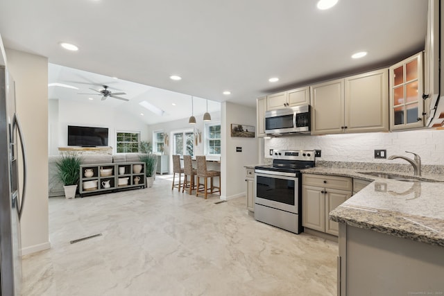 24 Wapping Wood Rd, Ellington, CT 06029 - kitchen featuring stainless steel appliances, backsplash, a ceiling fan, vaulted ceiling, and light stone countertops