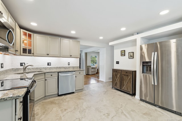 24 Wapping Wood Rd, Ellington, CT 06029 - kitchen with appliances with stainless steel finishes, light stone counters, decorative backsplash, recessed lighting, and glass insert cabinets