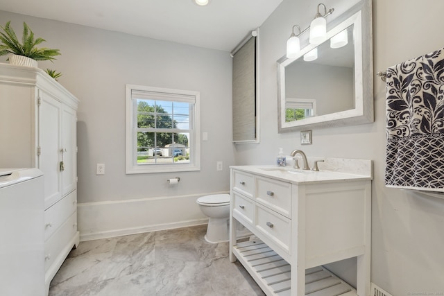 24 Wapping Wood Rd, Ellington, CT 06029 - bathroom with washer / clothes dryer, vanity, and marble look tiles