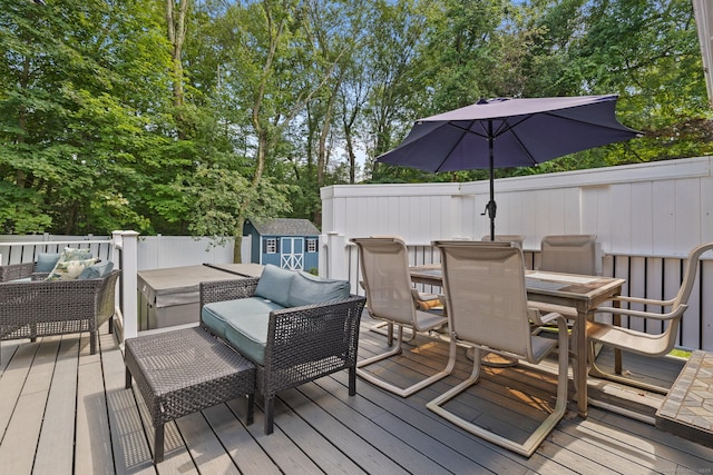 24 Wapping Wood Rd, Ellington, CT 06029 - deck featuring outdoor dining space, outdoor lounge area, a shed, and view of scattered trees