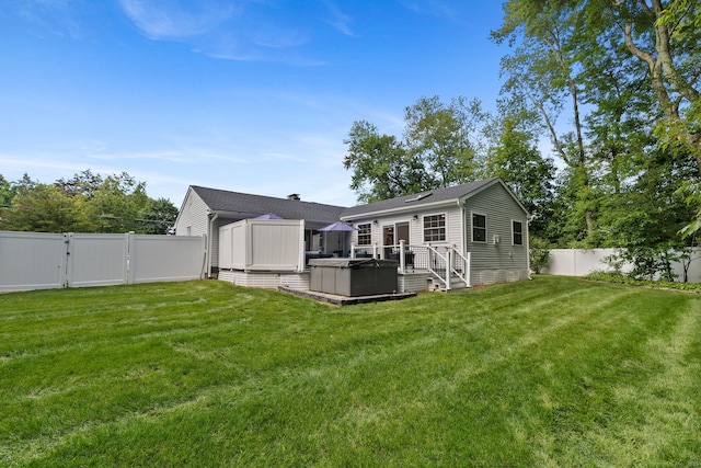 24 Wapping Wood Rd, Ellington, CT 06029 - back of house featuring a fenced backyard, a gate, a wooden deck, and a hot tub