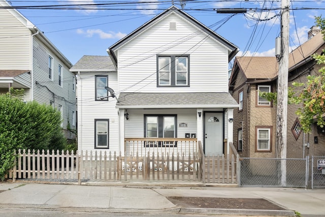 237 Helen St, Bridgeport, CT 06608 - view of front facade with covered porch, a fenced front yard, a gate, and a shingled roof